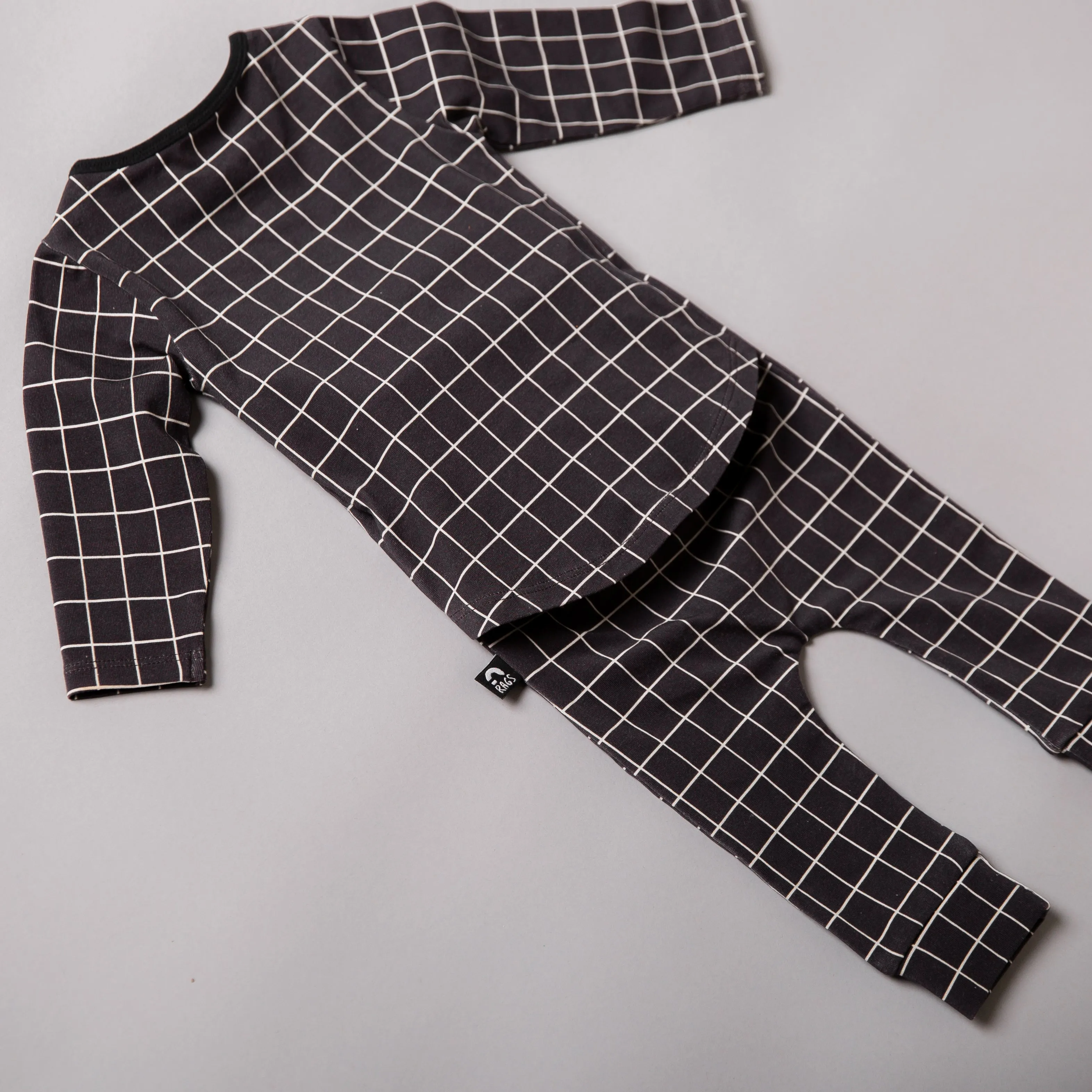 Peekabooty™ Rag Romper - Black Grid